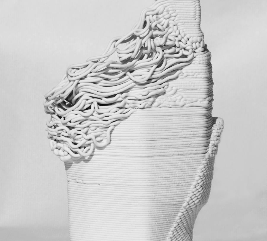 A 3D-printed porcelain ceramic piece, with differently-textured sections.