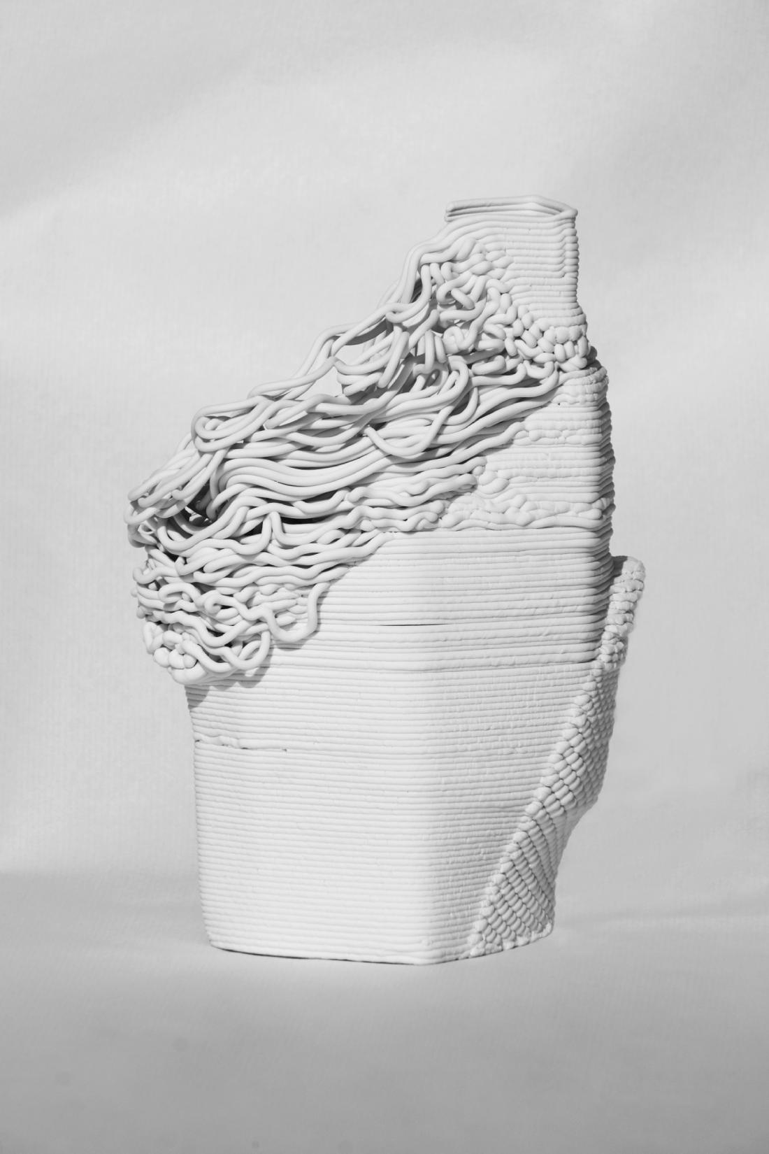 First piece, made of printed porcelain. The layers collapse on the left side, and a well-defined patch of knitted-like texture emerges from the bottom-right.
