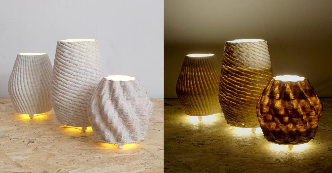 The three lit lamps, mounted as table lamps. The picture compares how the lit lamps look with the room's lights on and the room's lights off. The lamp's light shines very visibly through the printed layers when in darkness.